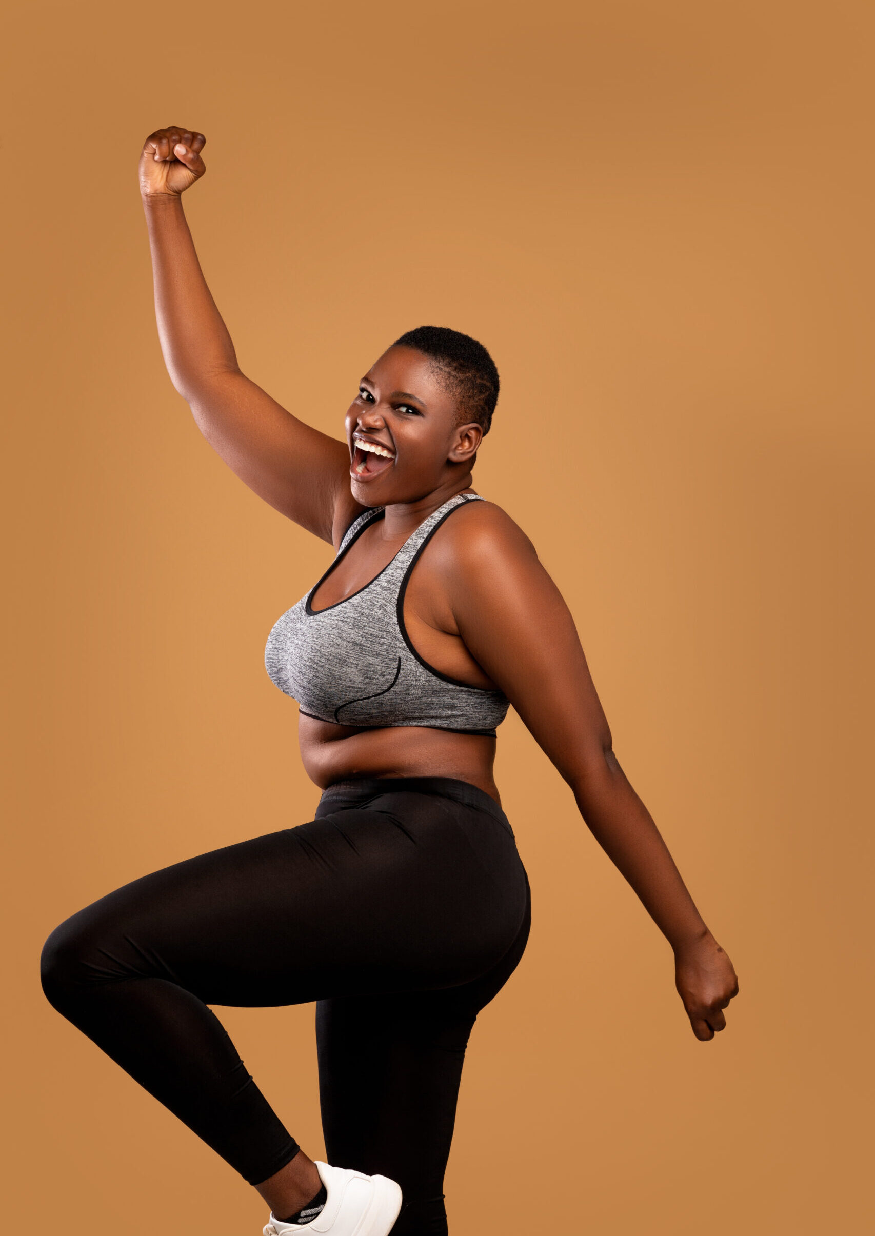 This picture shows a woman who's excited to be on her weight loss journey, and she's hopeful because of the amazing progress that she's made thank to Grateful Healthcare!